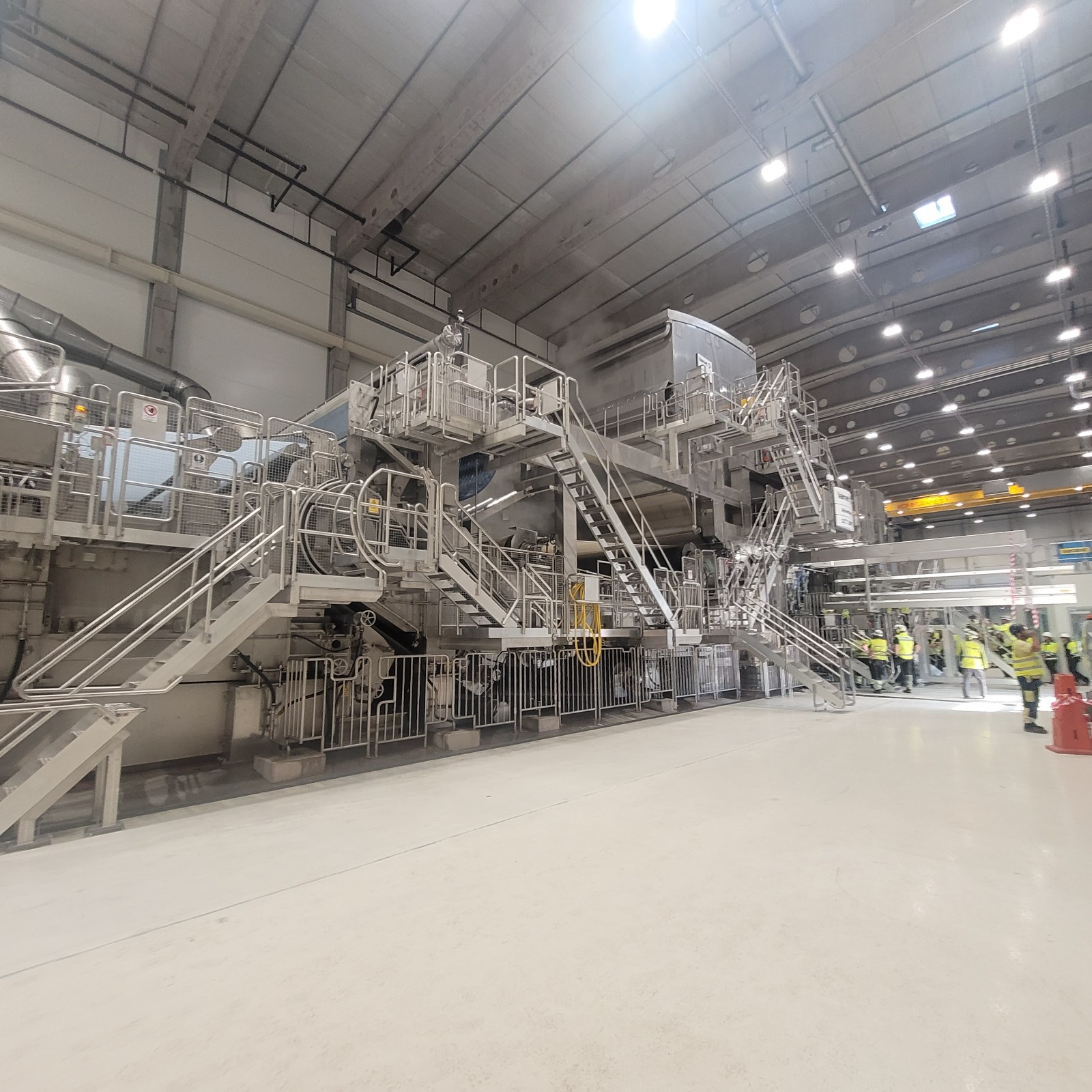 Paper machine hall with access platforms